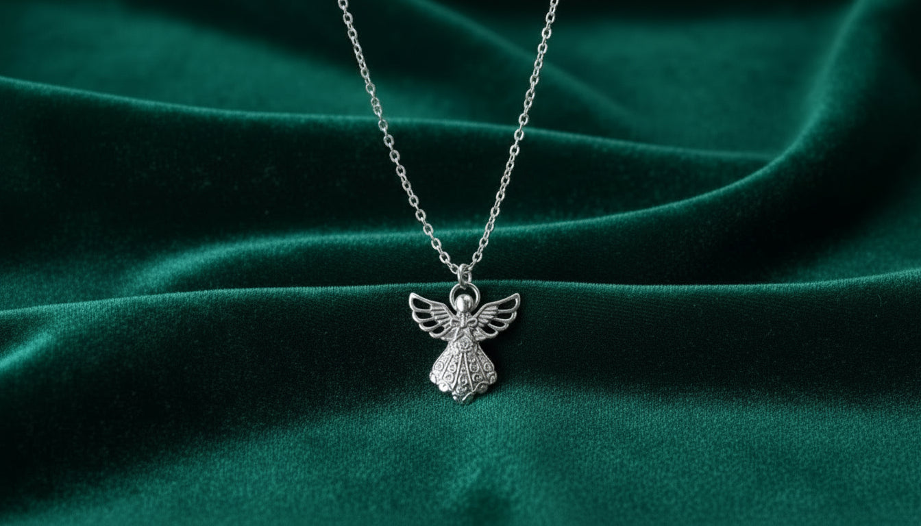 Necklace with a small angel pendant on a green background