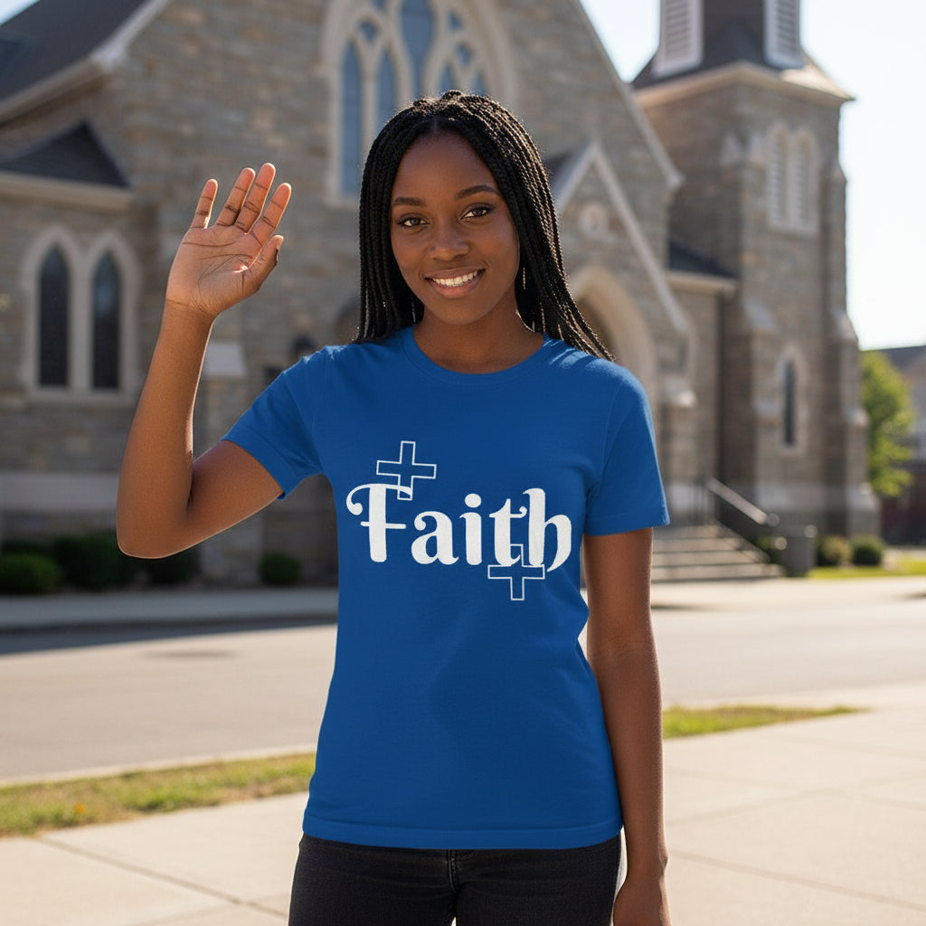Person wearing a blue t-shirt with 'Faith' printed on it, standing in front of a church.