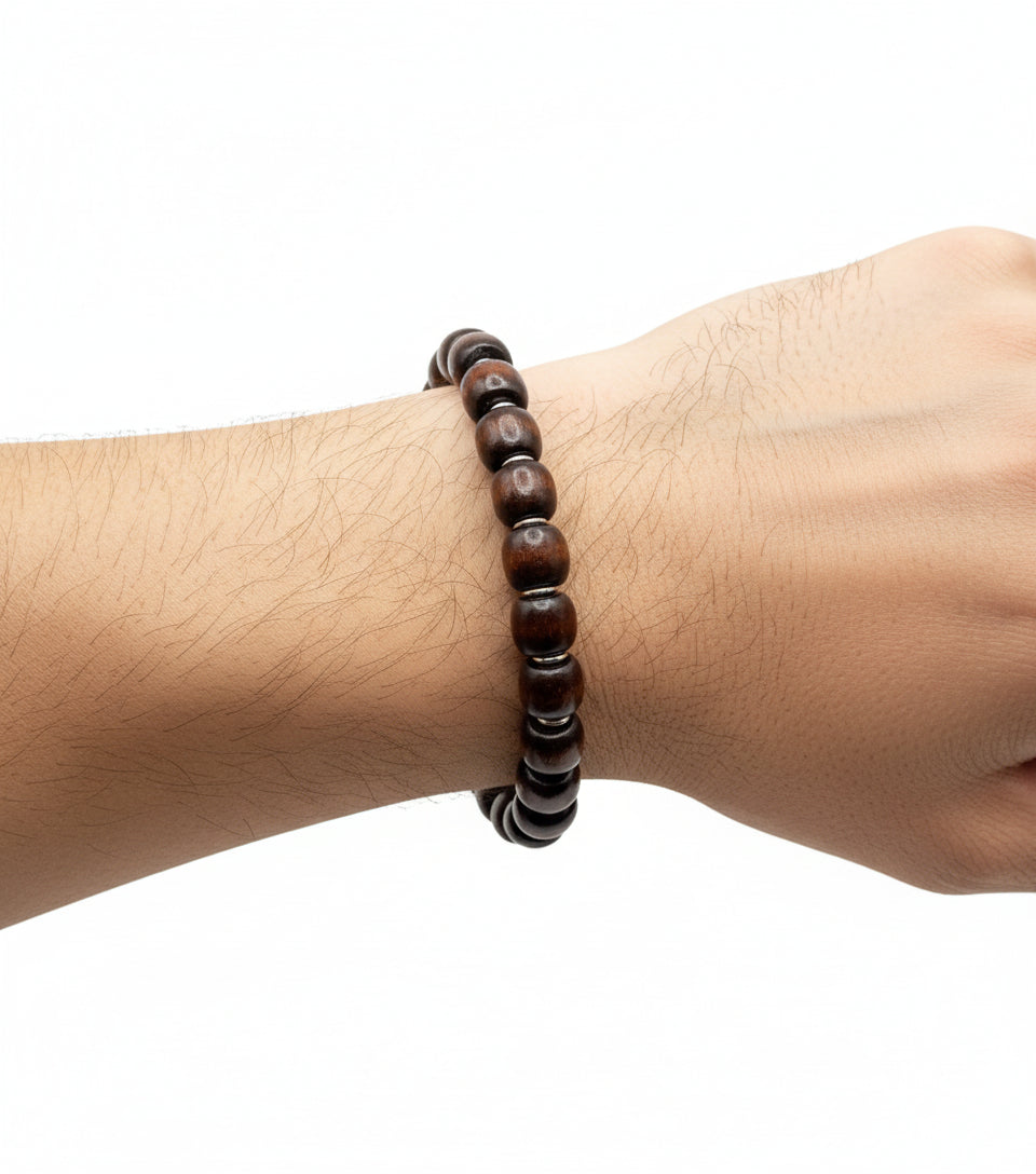 Person wearing coconut brown wood barrel bracelet – natural unisex handmade accessory