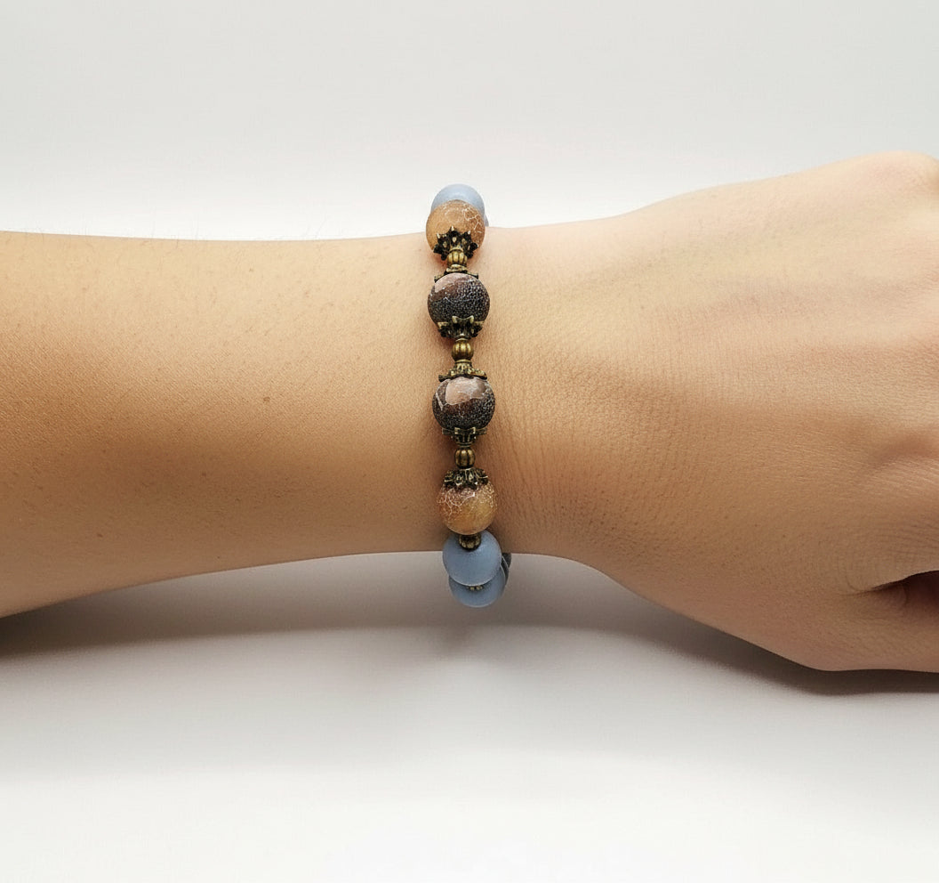 Hand wearing Blue Wooden Agate Bracelet – handmade natural gemstone accessory