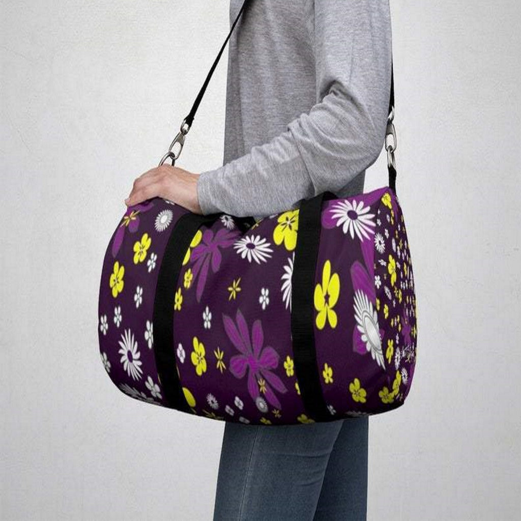 woman carrying travel duffel bag