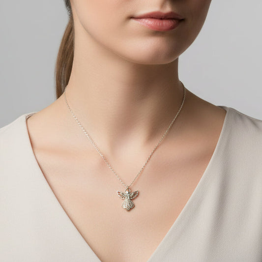 Woman wearing a handmade silver stainless steel angel pendant necklace 16 inch chain