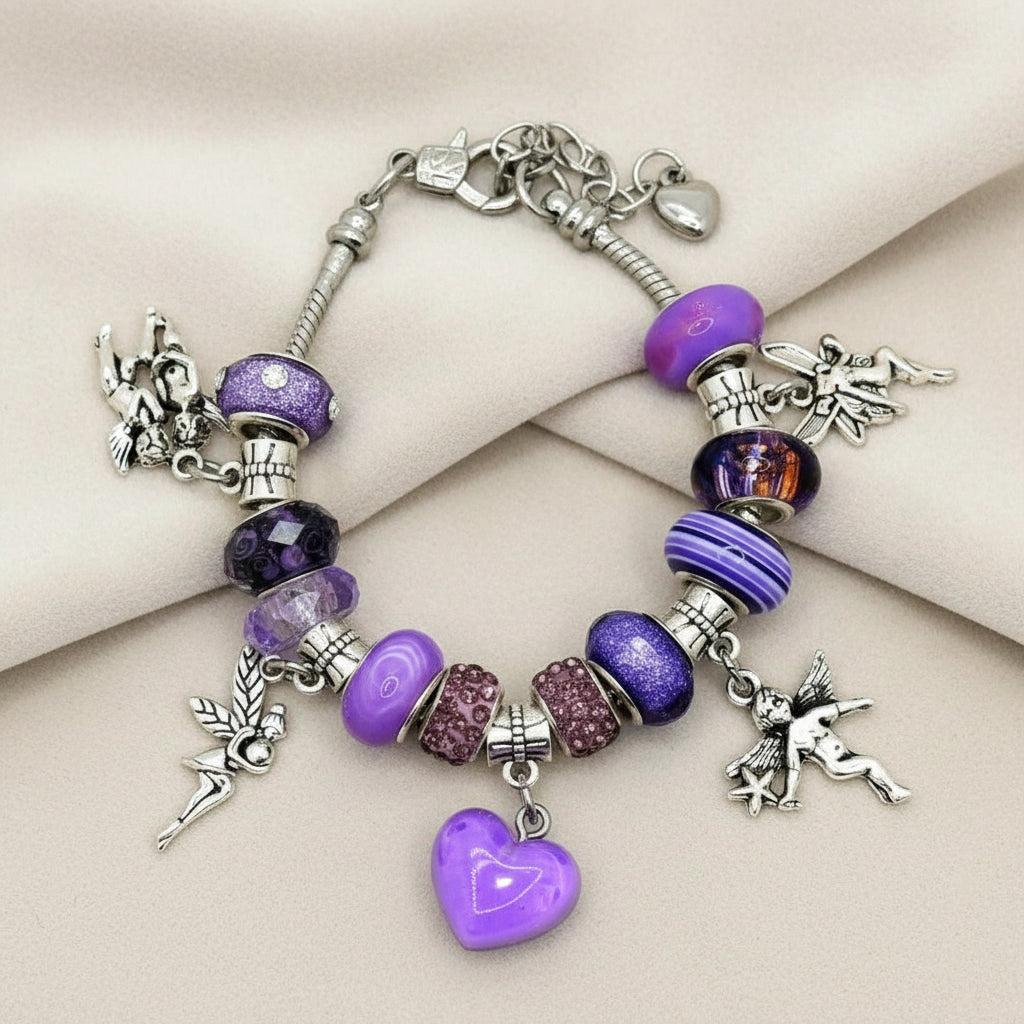 Bracelet with purple beads and charms on a beige surface