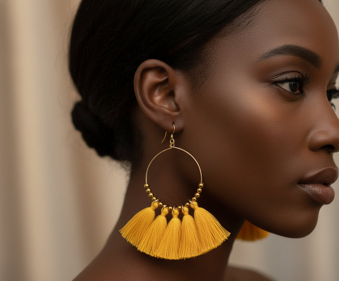 Handmade gold tassel hoop earrings with copper wire and golden seed beads