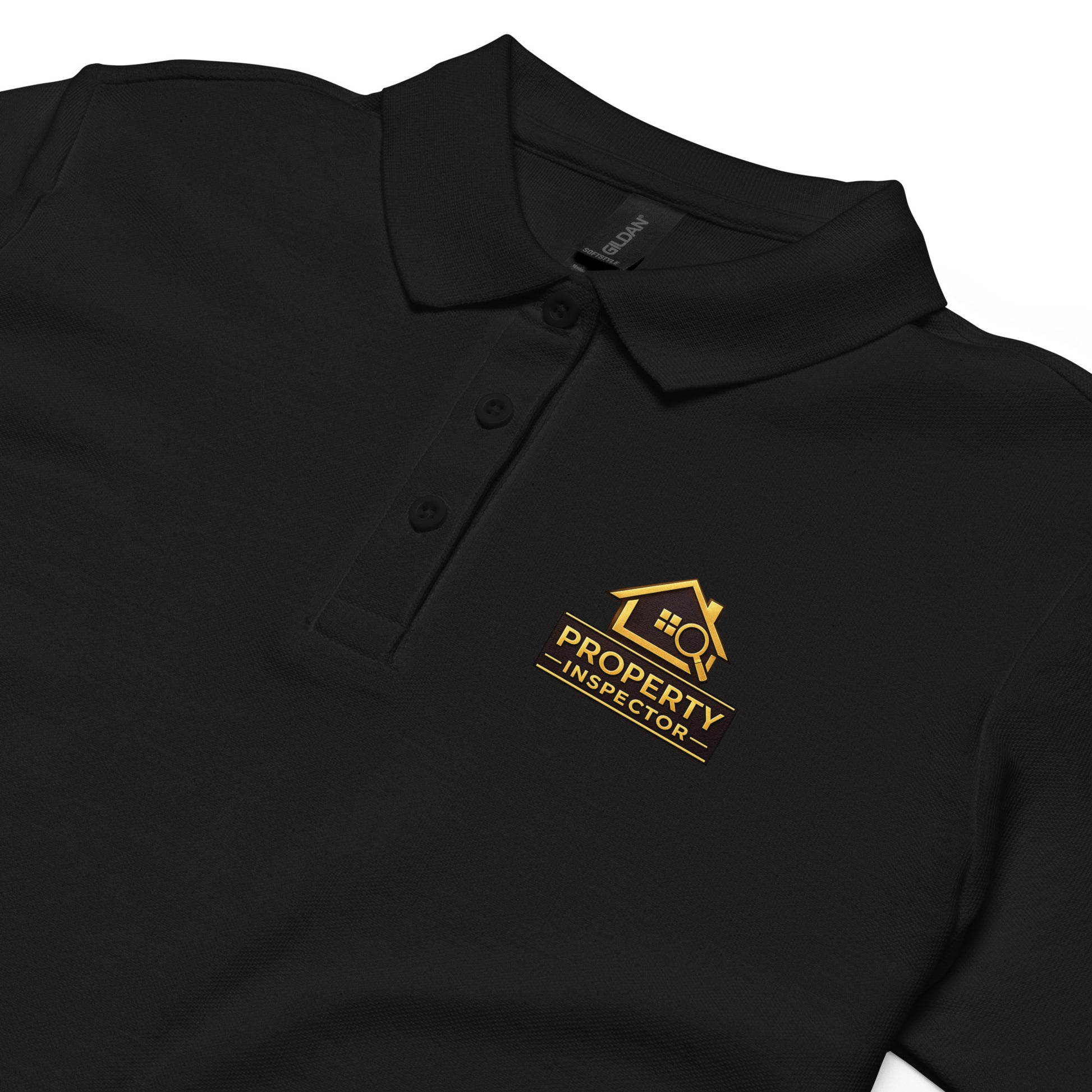 Close-up of the Property Inspector logo printed on a black women’s polo work shirt.