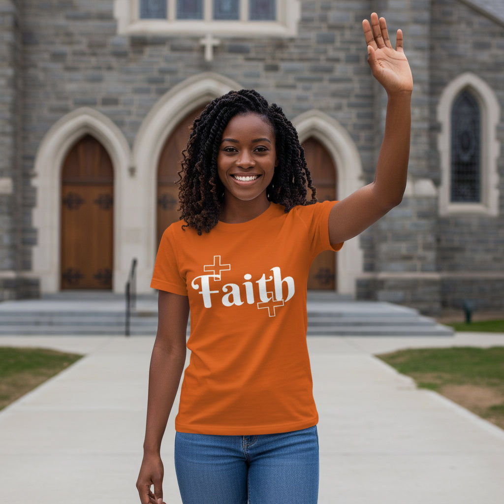 Woman wearing an orange 'Faith' t-shirt in front of a stone building