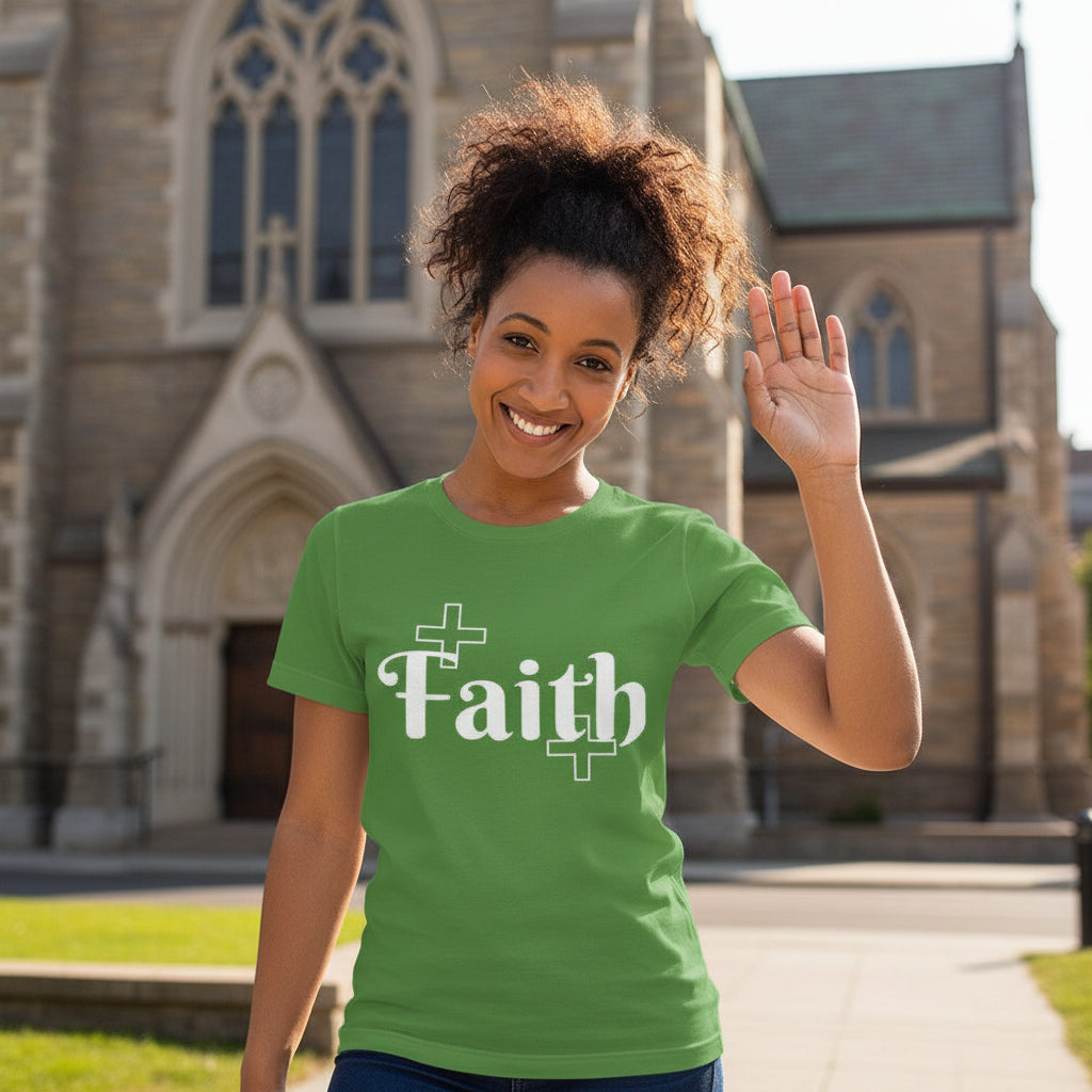 Woman wearing a green t-shirt with 'Faith' printed on it, standing in front of a church.