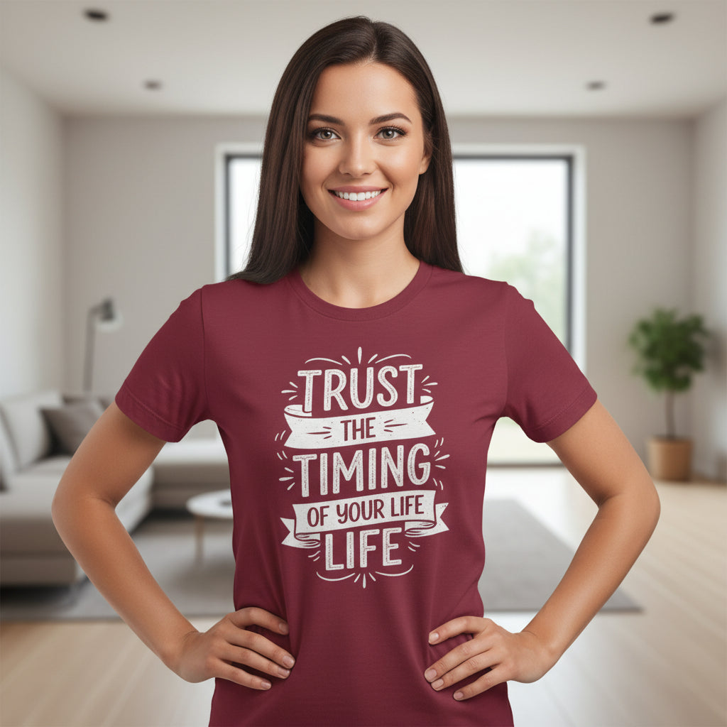 Woman wearing a maroon t-shirt with motivational quote in a living room setting