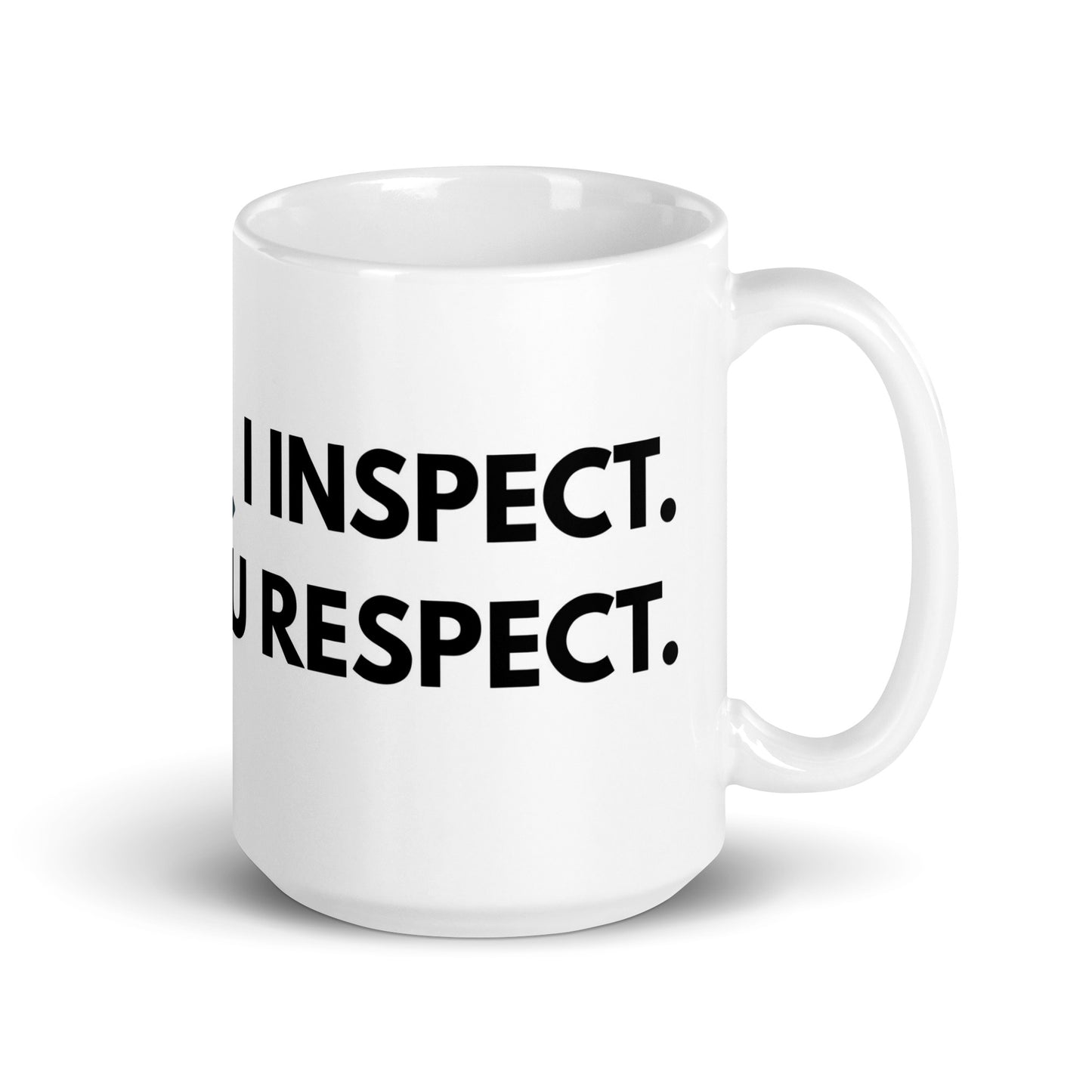 Side angle of white field inspector mug showing humorous inspection quote.