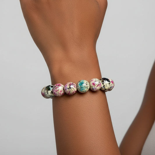 Hand wearing multicolor acrylic bead bracelet – colorful handmade jewelry accessory