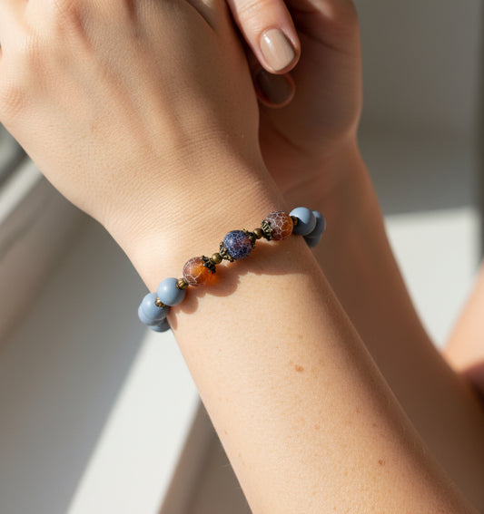 Hand wearing Blue Wooden Agate Bracelet – handmade natural gemstone accessory