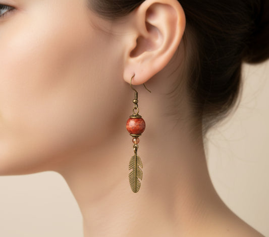 A woman wearing handmade wooden dreamcatcher earrings with bronze accents and beads