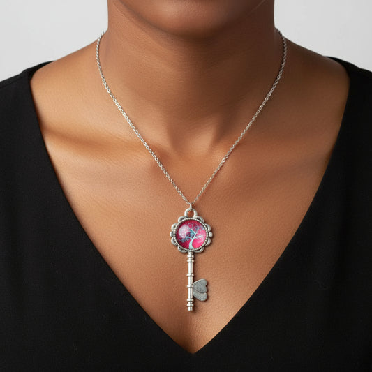 A woman wearing a silver Tree of Life cabochon necklace on stainless steel chain