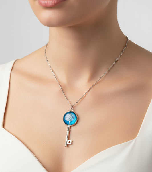 A woman wearing the Cabochon Tree of Life Necklace with antique silver pendant